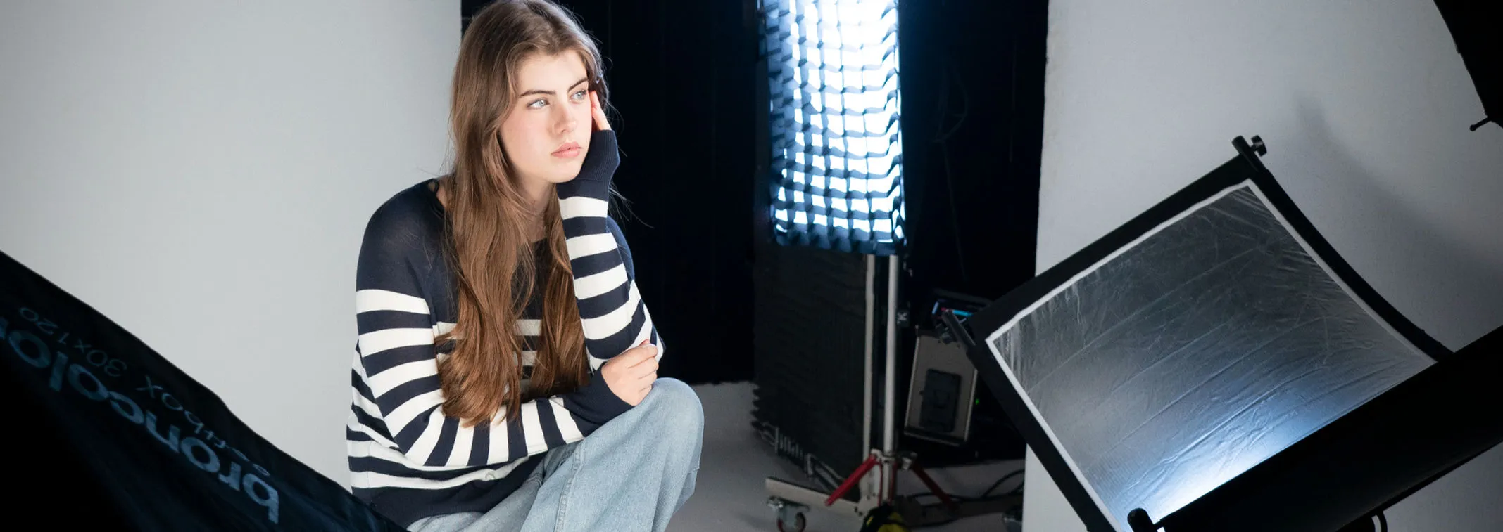 Twyla Coltman at work on a studio lighting set
